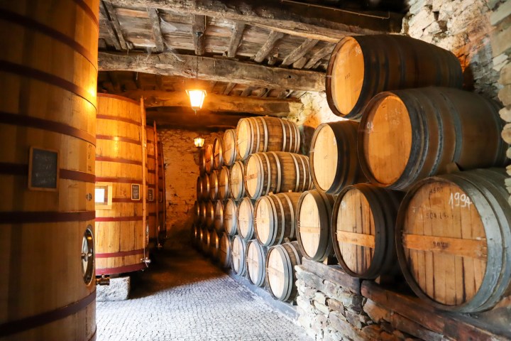 a barrel sitting next to a fireplace