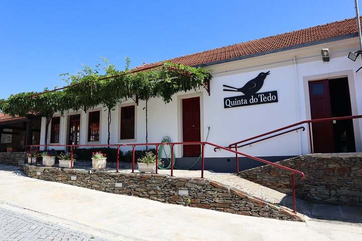 a house that has a sign on the side of a building