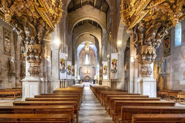 a wooden statue in front of a building