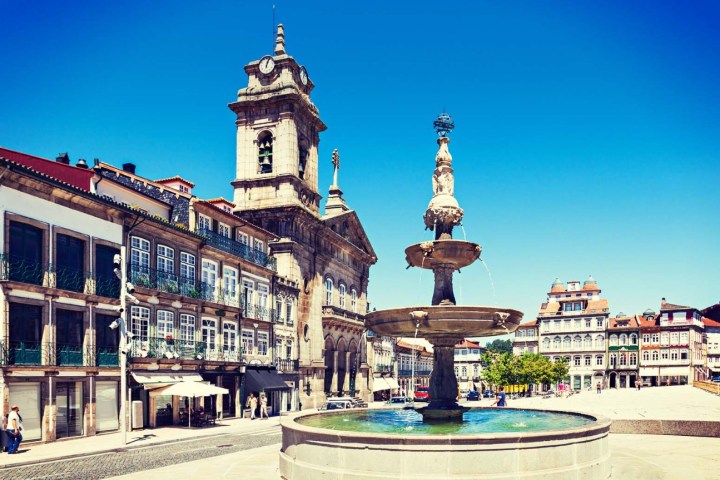 a clock tower in front of a building